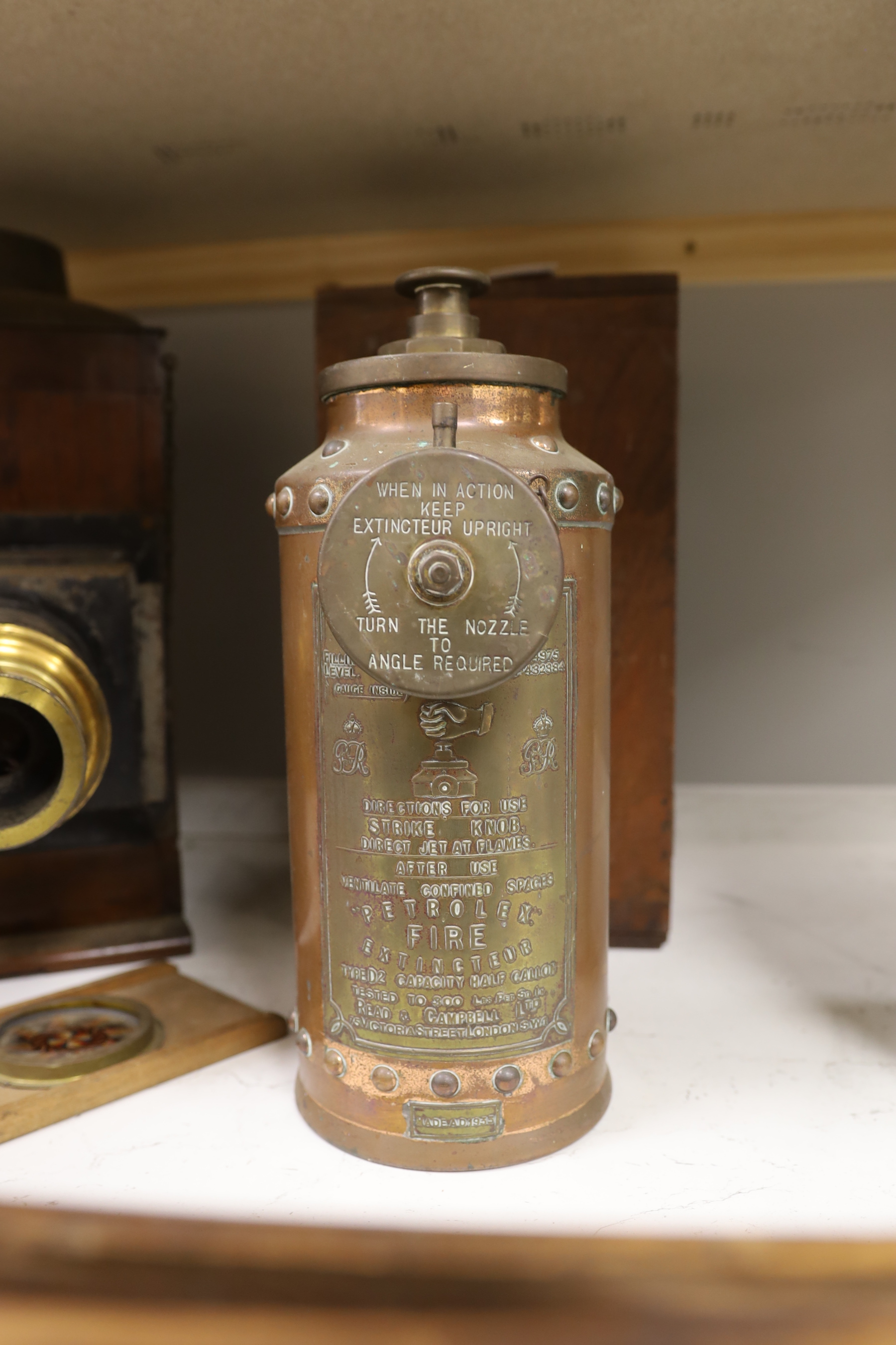 A Victorian microscope magic lantern and a copper fire extinguisher